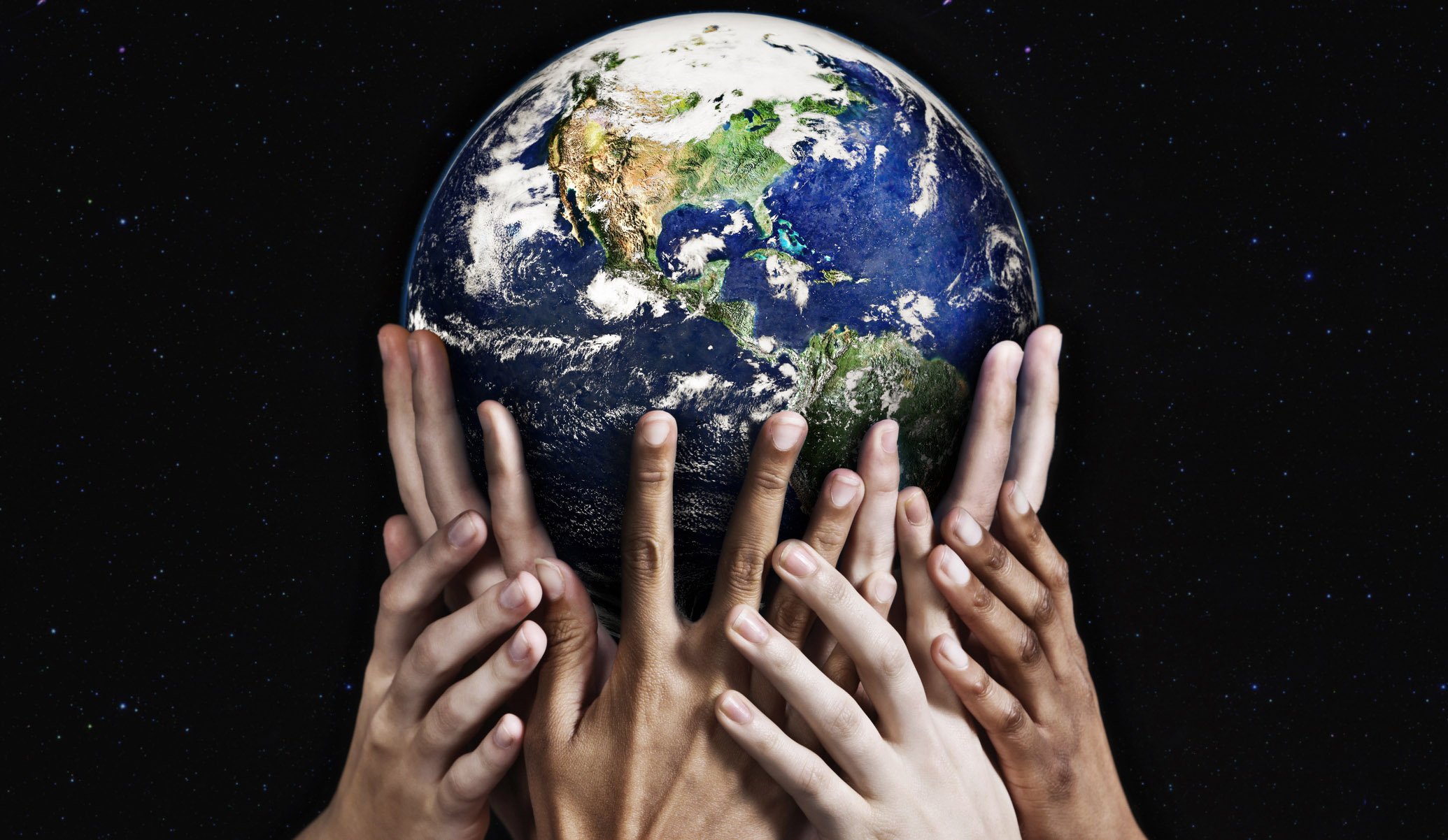 Hands gripping Earth